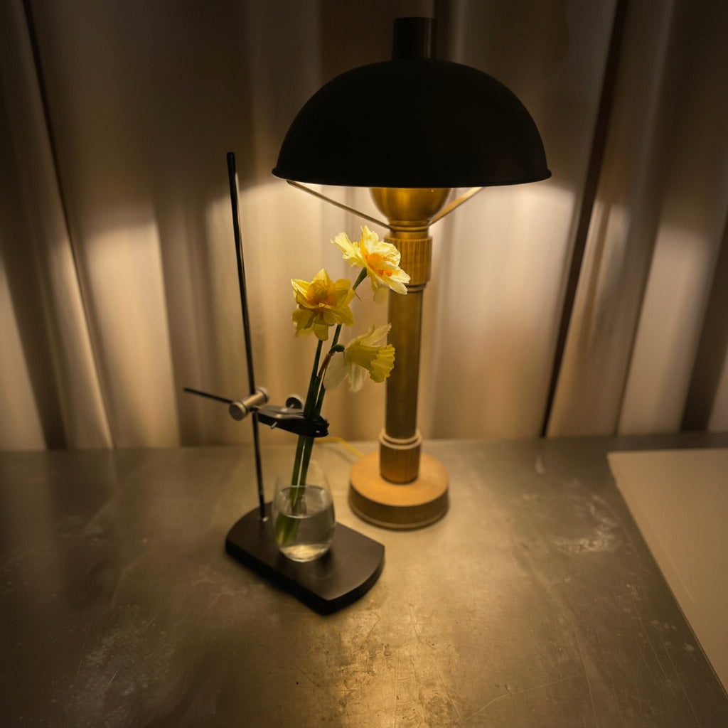 Table lamp with a Curator Table Mount and flowers on a table